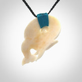Hand carved natural dolphin bone pendant. Hand made bone dolphin necklace, delivered with Express Courier. Hand crafted bone dolphin koru pendant. One only necklace.